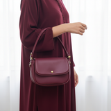 Najmat Cuir Bordeaux djellaba close-up forearm