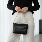 Nova Noir Croco small clutch with black sweater