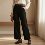 Woman in black trousers and ivory blouse with soft daylight wearing burgundy 224F Balem Bordeaux slip-ons