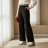Woman in black trousers and ivory blouse with soft daylight wearing silver 157F Bayan Doré loafers