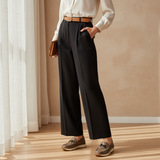 Woman in black trousers and ivory blouse with soft daylight wearing taupe 490F Zahir Sépia loafers